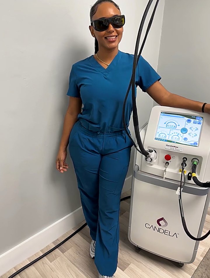 Crystal Cruz beside the spa's Candela GentleMax Pro Plus laser